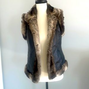 Genuine leather faux fur vest.  Brand new!  XS